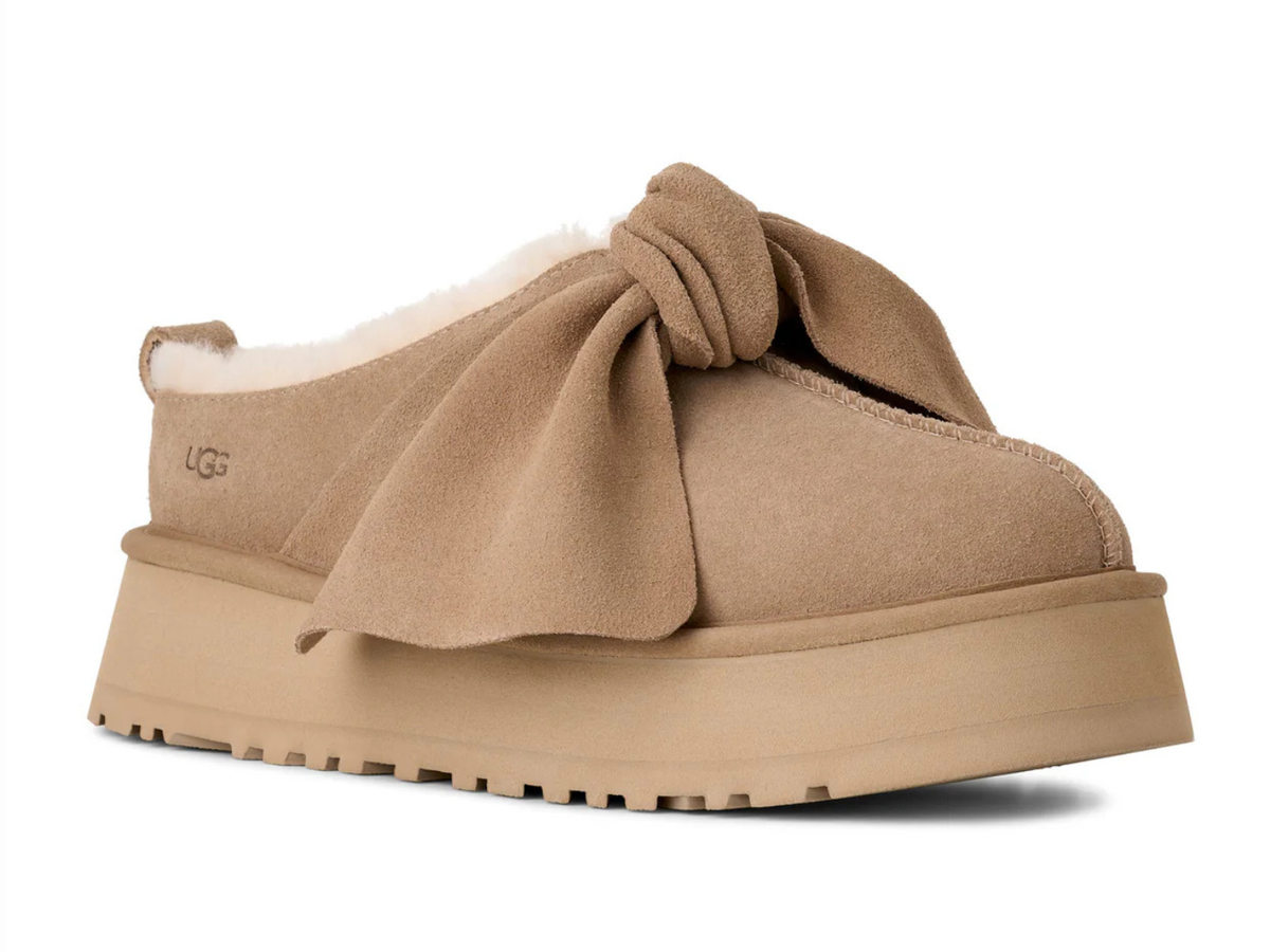 UGG Platform Slip-On Bow in sand colored suede with a large decorative bow and platform sole.