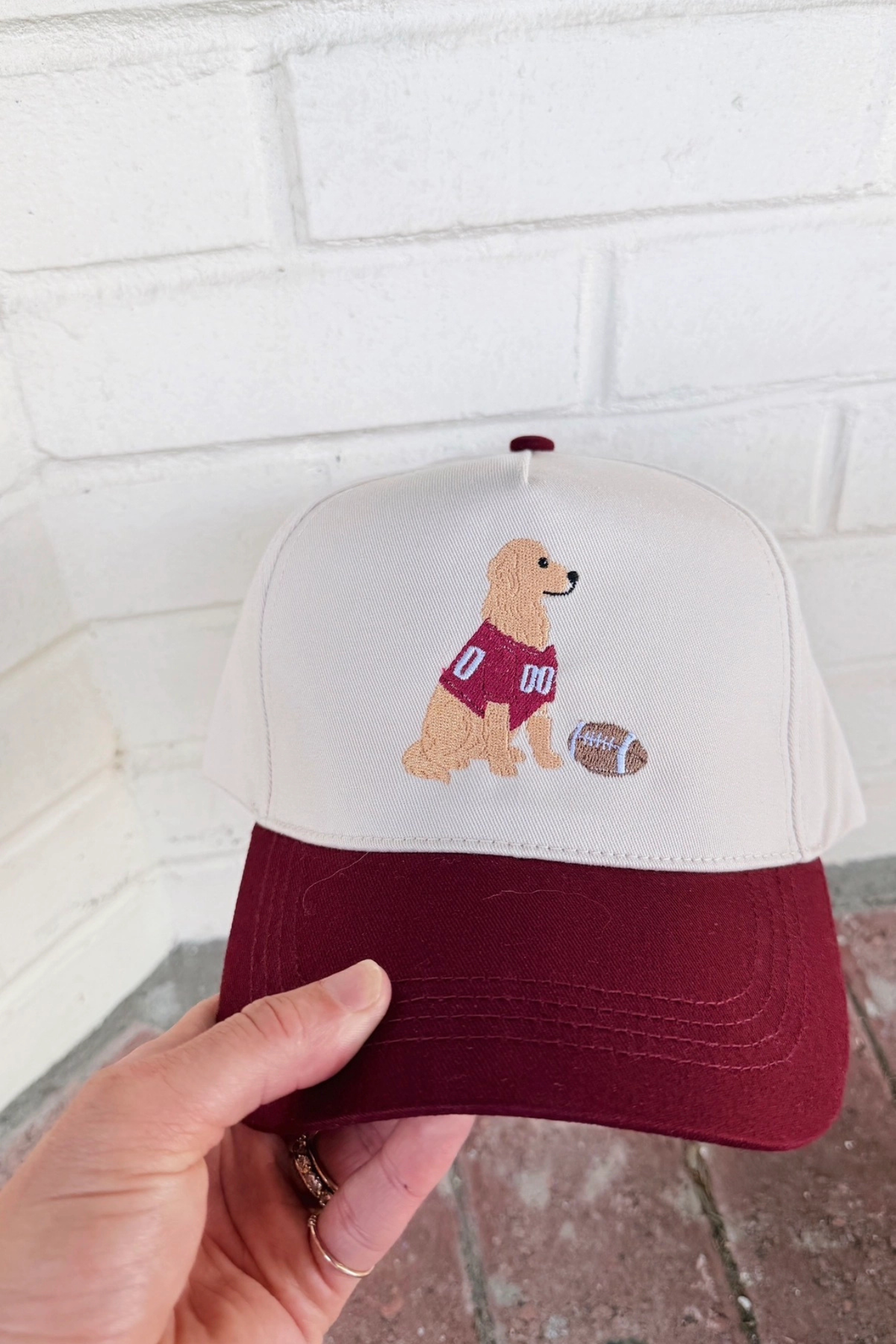 crimson and white trucker hat with golden retriever at jcole shoes tulsa