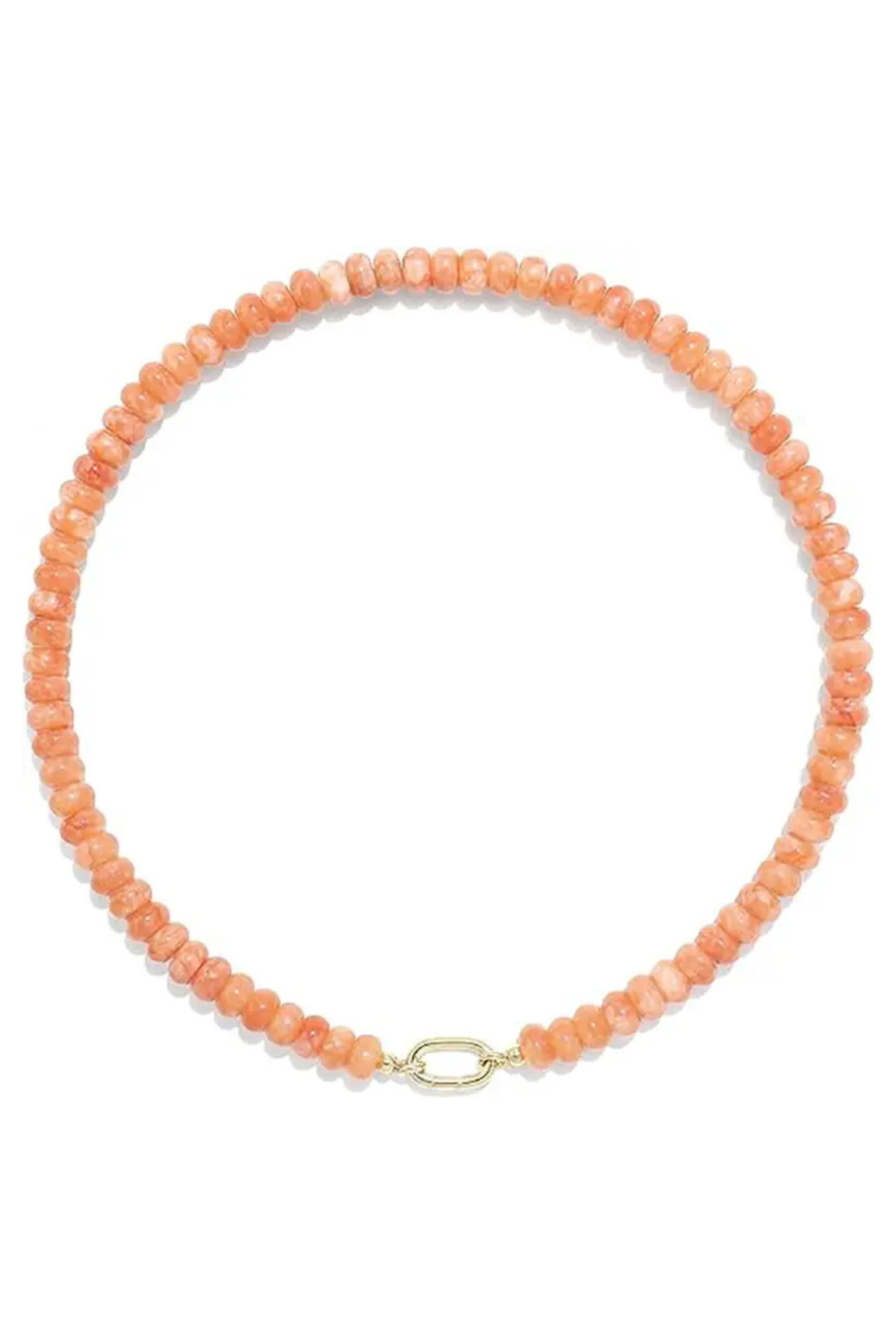 A beaded necklace made of small peach-orange faceted beads with a gold oval link clasp, shown on a plain white background.
