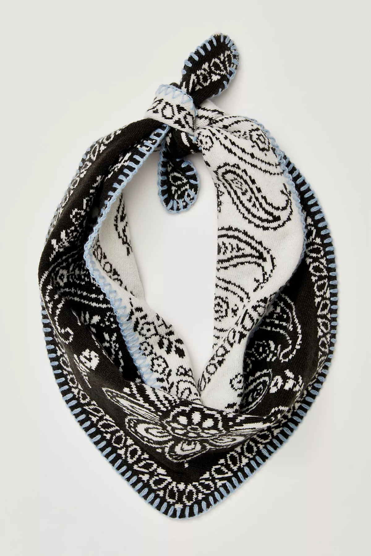 A black and white paisley bandana scarf with a light blue border, knotted at the top and displayed on a clean white background.