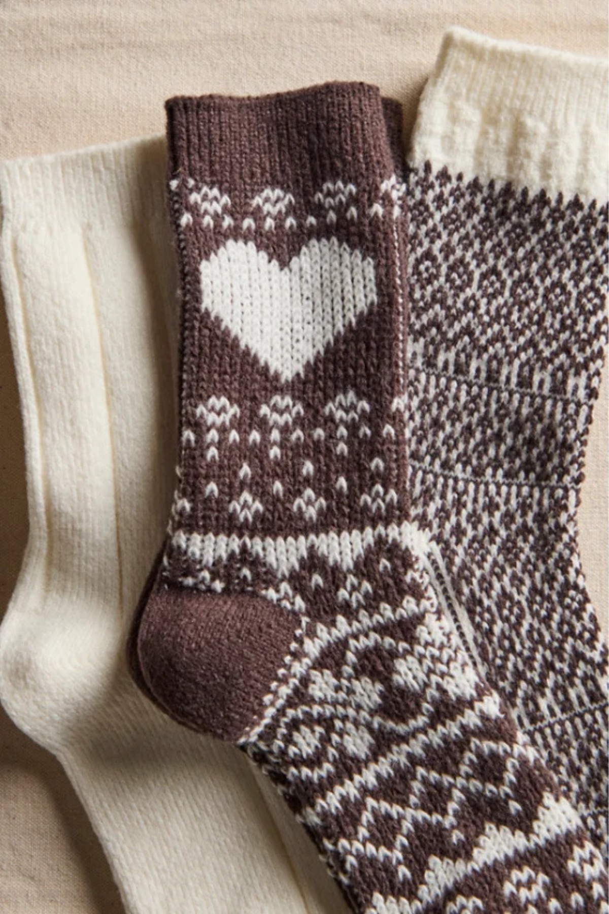 Knitted socks with heart pattern on a beige background
