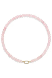 A delicate pink beaded necklace with a small gold clasp, displayed on a clean white background.