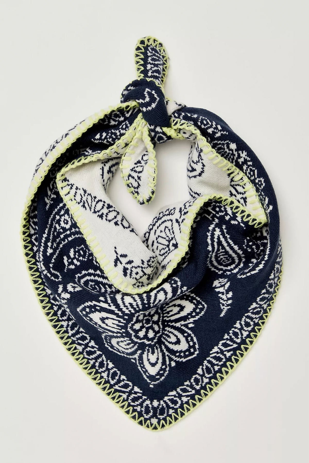 Navy blue bandana with white paisley pattern on a light gray background