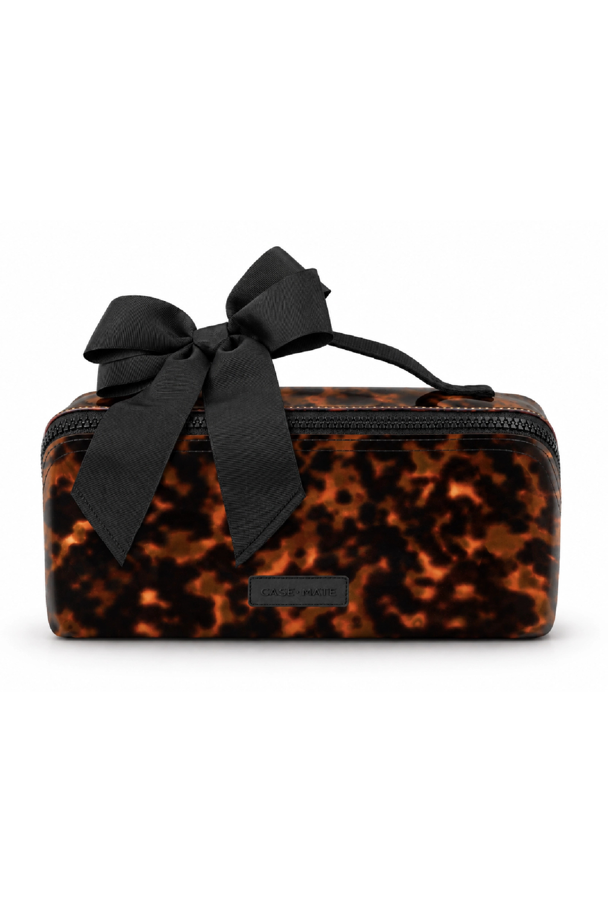 A rectangular cosmetic pouch with a black and brown tortoiseshell pattern, featuring a large black satin bow on top and a small black brand plaque on the front.