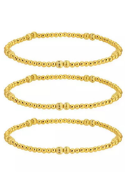 Three gold beaded stretch bangles stacked vertically on a plain white background.