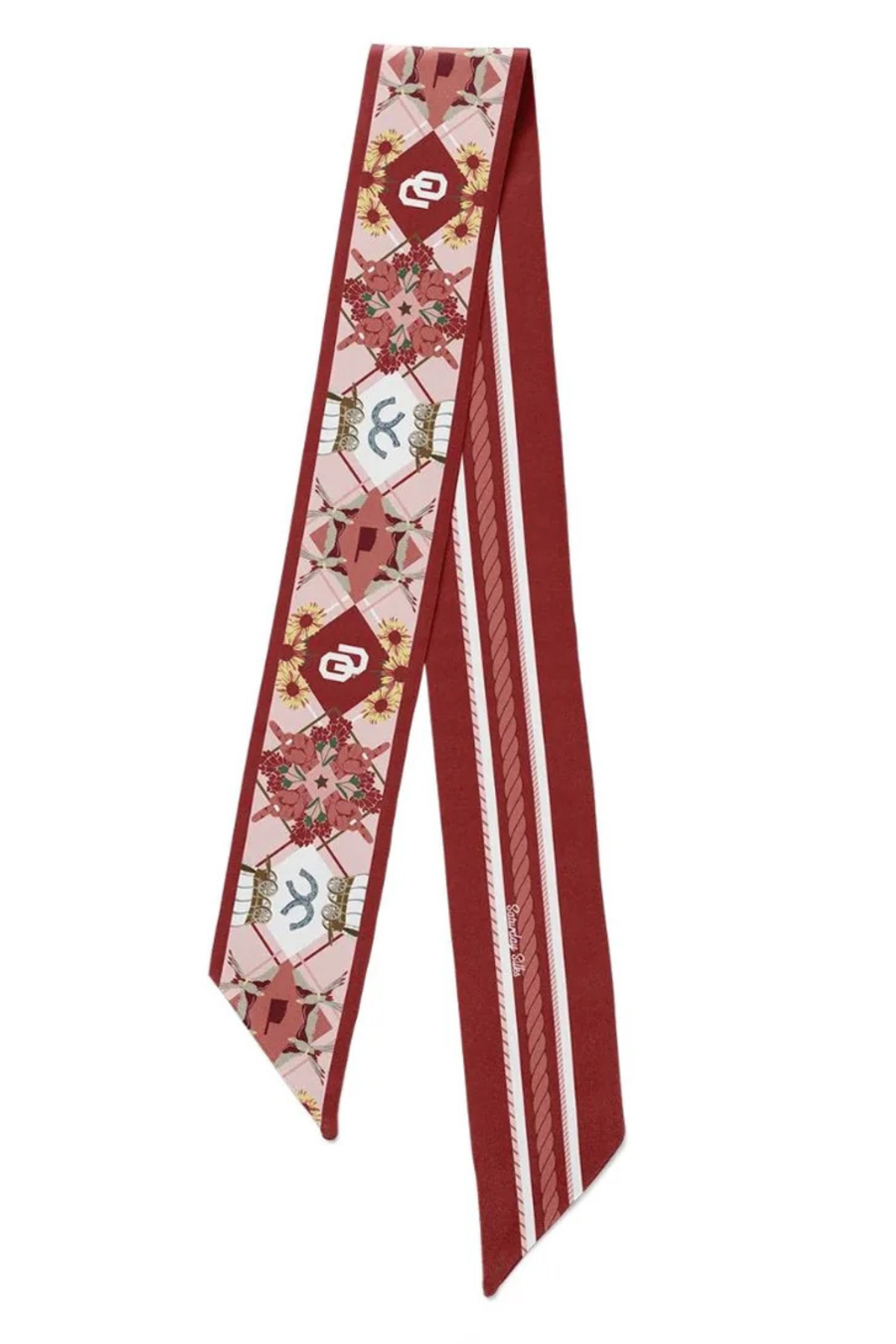 A long necktie with a deep red base, featuring a central panel with a light pink and white geometric pattern containing stylized letter 'S' motifs, and a solid red border.