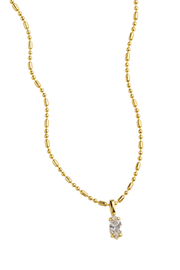 A delicate yellow gold chain necklace with a small, clear oval-cut gemstone pendant, displayed against a solid white background.