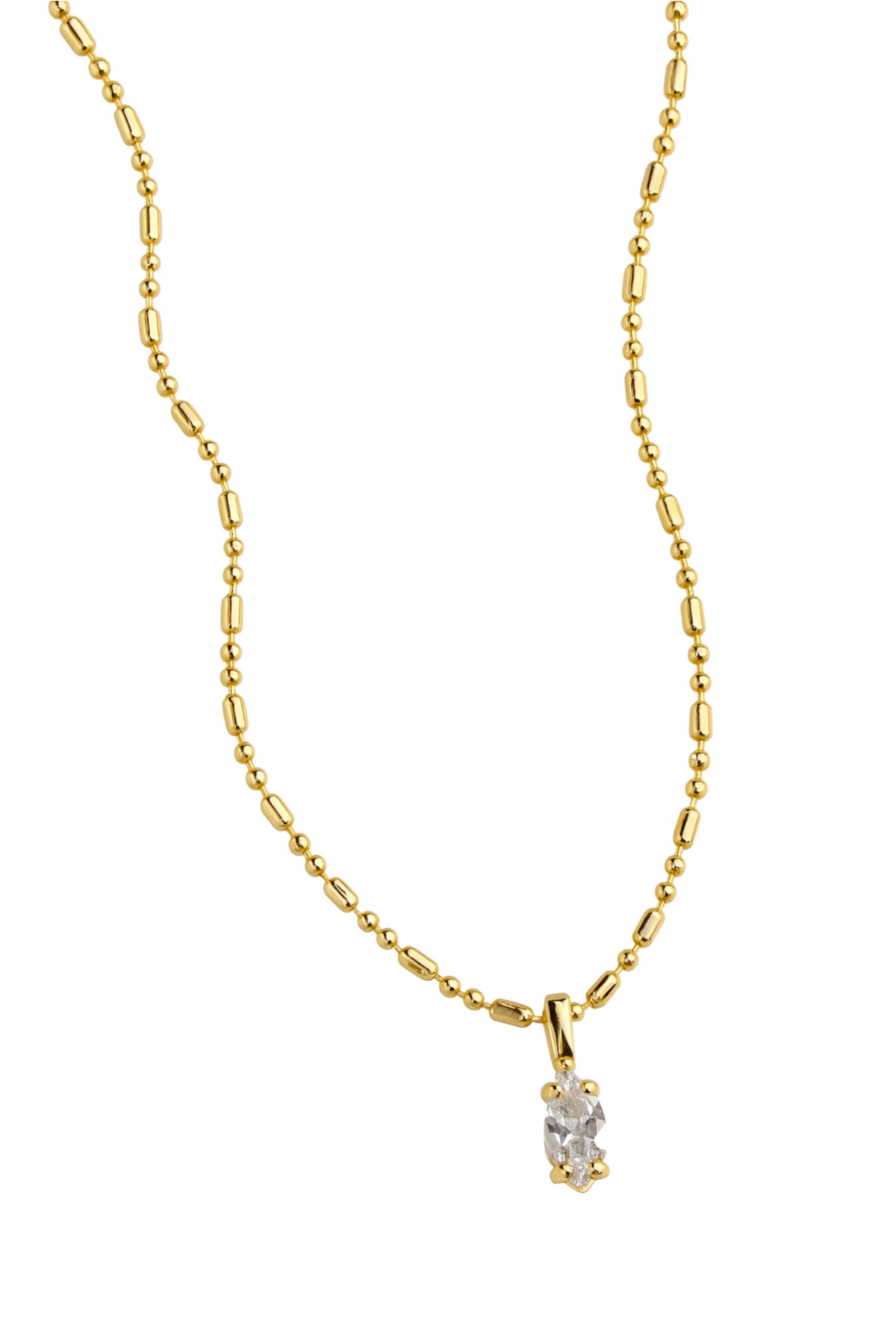 A delicate yellow gold chain necklace with a small, clear oval-cut gemstone pendant, displayed against a solid white background.