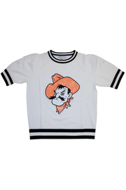 A white short-sleeve ringer t-shirt featuring a distressed orange and black cartoon cowboy graphic on the front, with black and white striped ribbed collar, cuffs, and hem.