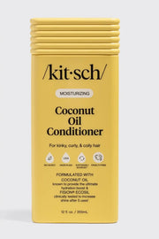 Kit-Sch Coconut Oil Conditioner in a yellow rectangular bottle with a ribbed cap, shown against a light gray background.