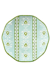 A scalloped ceramic plate with a light aqua background, featuring vertical white and green geometric patterns and a scalloped green rim.
