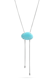 A silver-toned lariat necklace featuring a smooth, oval-shaped light blue turquoise stone pendant, suspended against a solid white background.