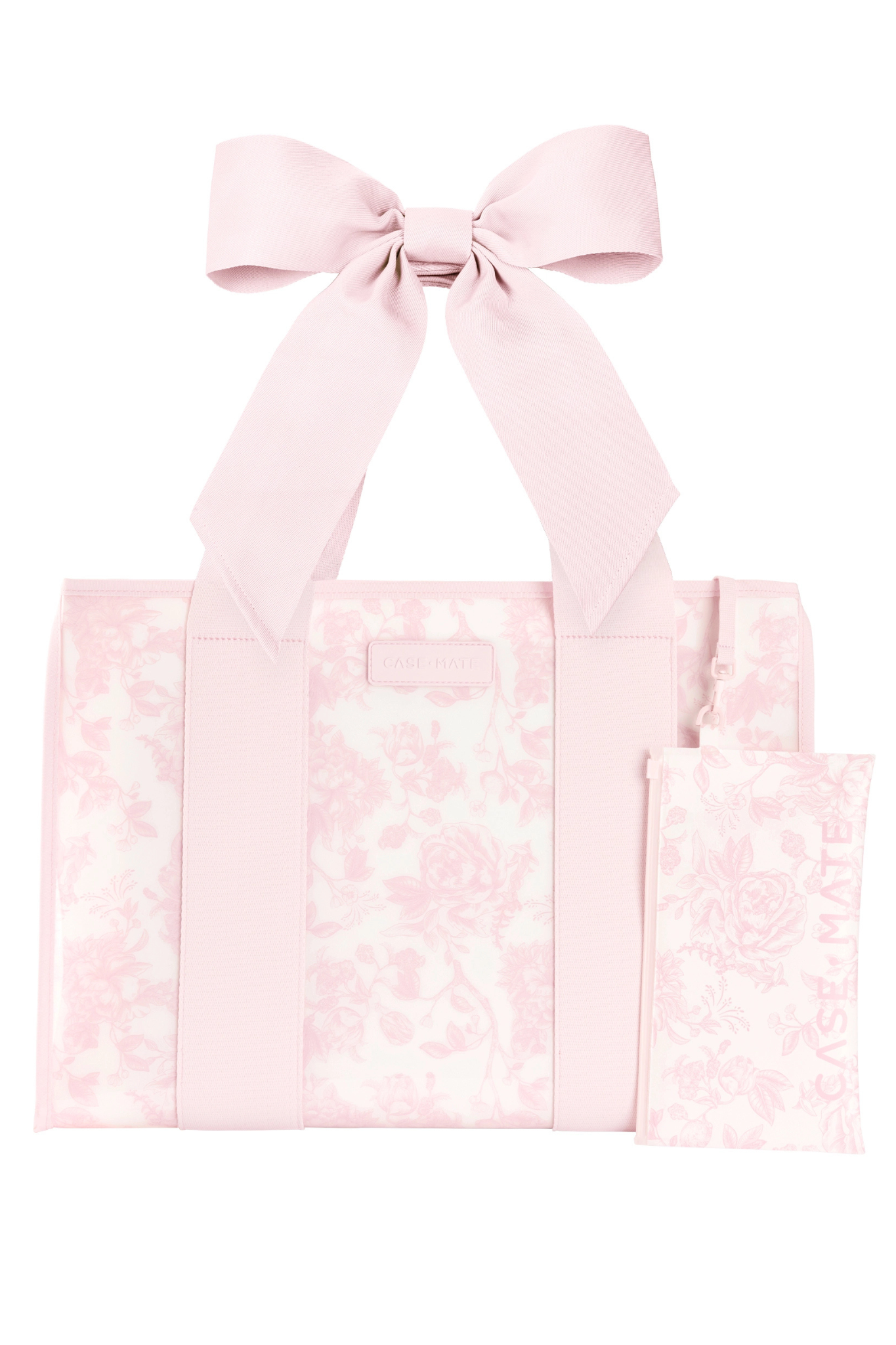 A light pink tote bag with a matching fabric bow on the handle and a small matching pouch, both featuring a subtle floral damask pattern, shown on a plain white background.