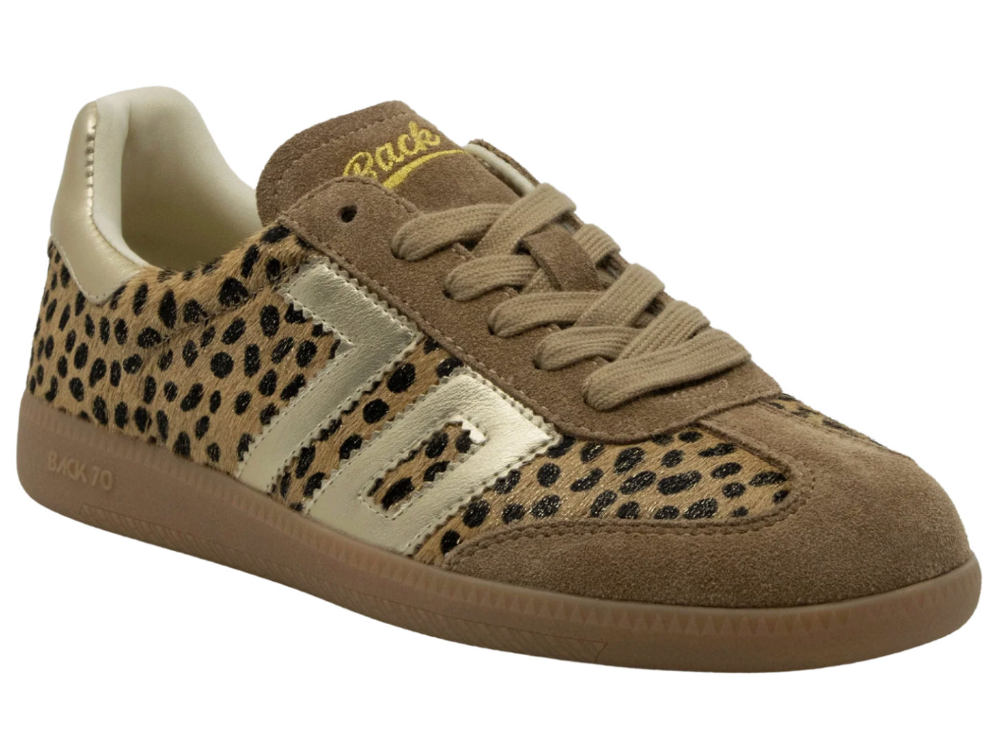 A low-top sneaker featuring a leopard print pattern on a tan base, suede overlays in brown, beige laces, and a gum sole. The brand name 'Sneaker' is printed in yellow on the tongue.