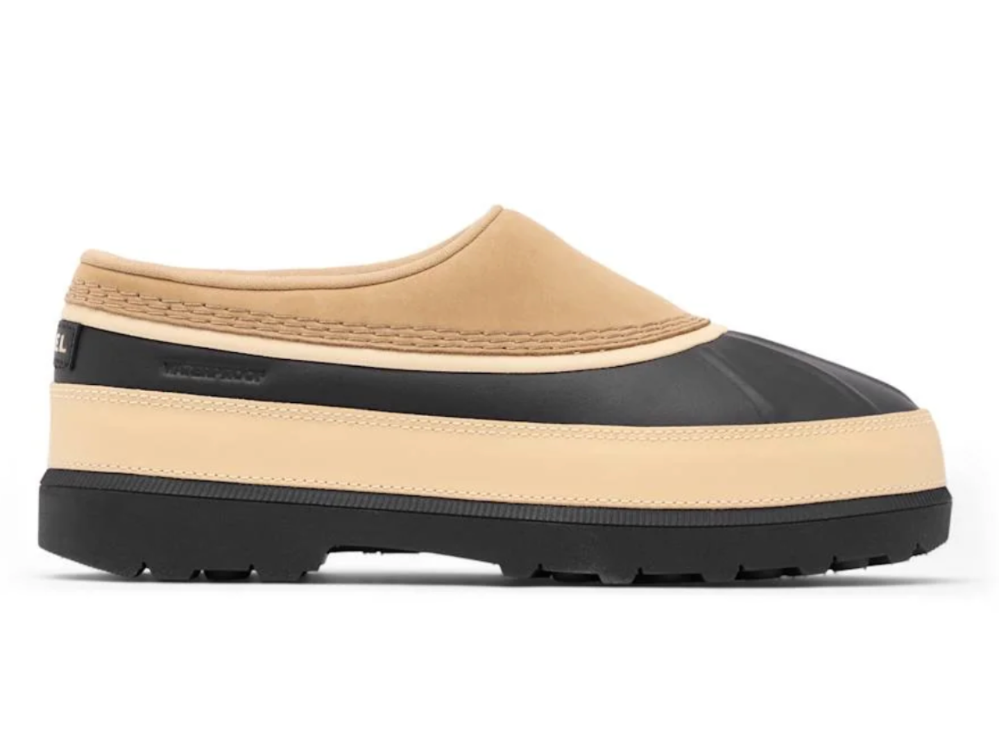 A slip-on clog shoe with a beige suede-like upper, a black rubber toe cap, and a thick beige and black platform sole, shown in profile against a white background.