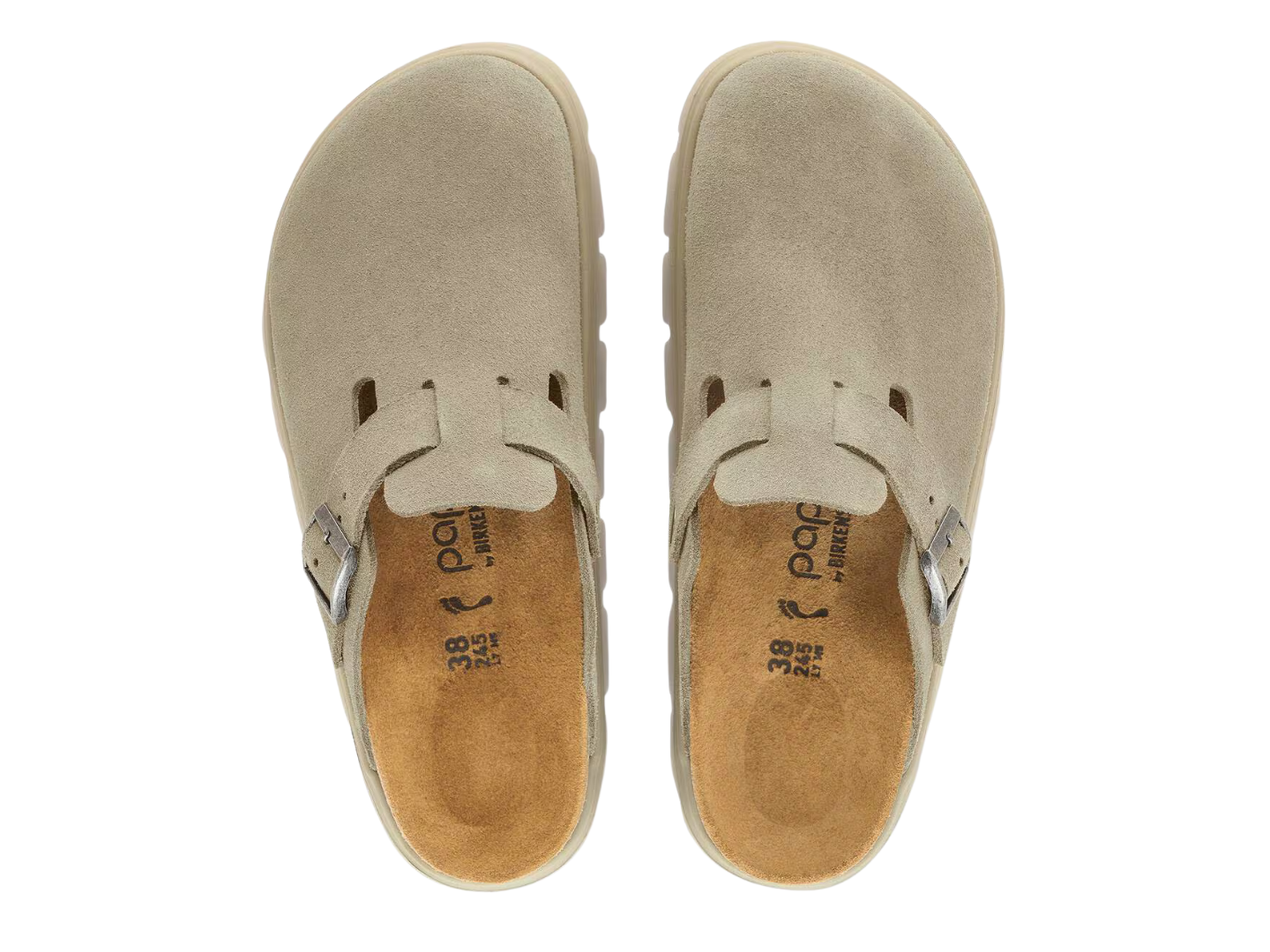 A pair of beige suede clogs shown from a top-down view on a white background, featuring a strap closure and a tan contoured footbed with the brand name 'poc' visible.