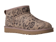 A single ankle-height slip-on boot with a distressed leopard print pattern in shades of brown and beige, featuring a tan sole and collar trim, shown against a plain white background.