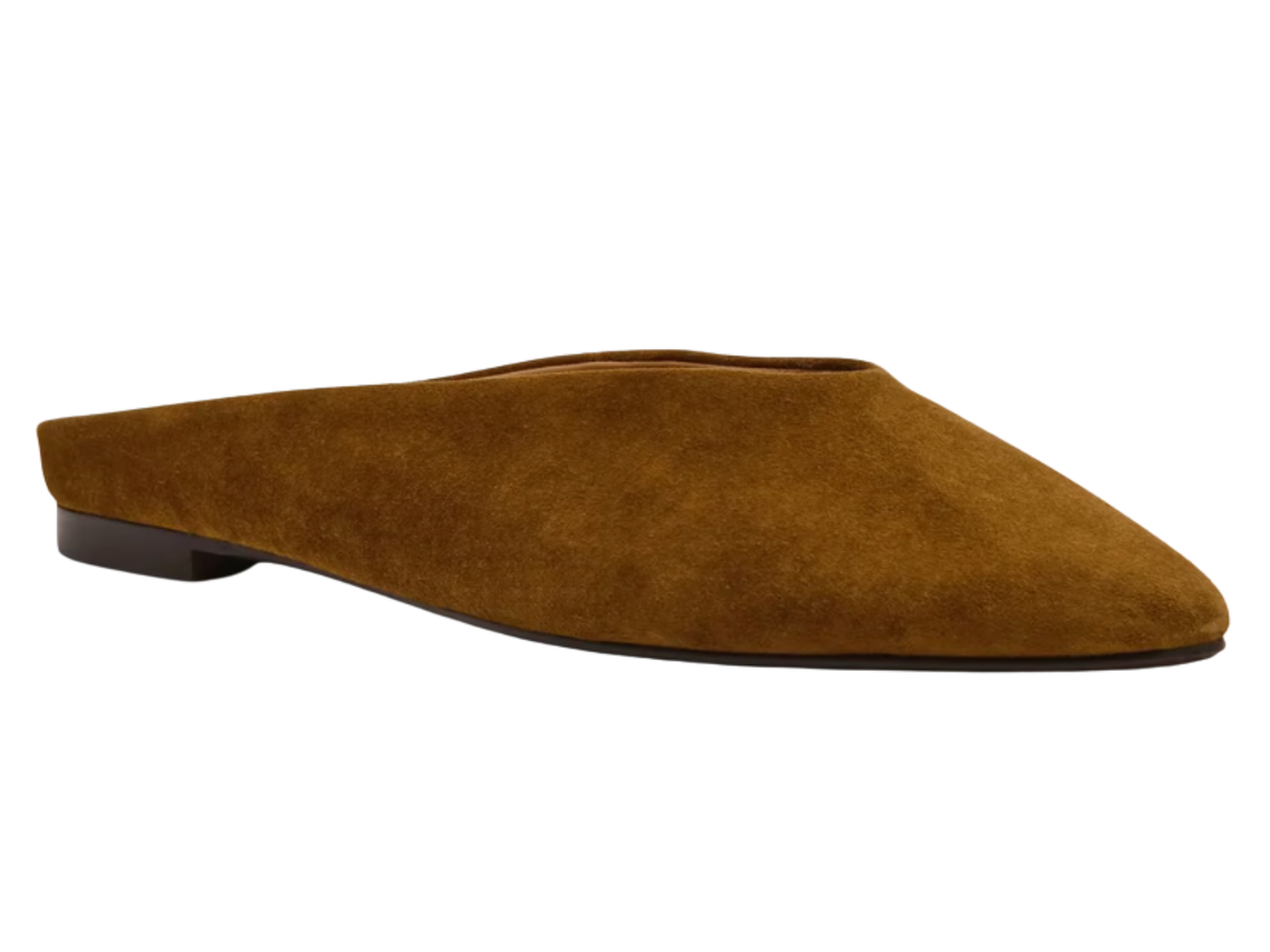 A single brown suede flat mule shoe with a pointed toe, shown in profile against a plain white background.
