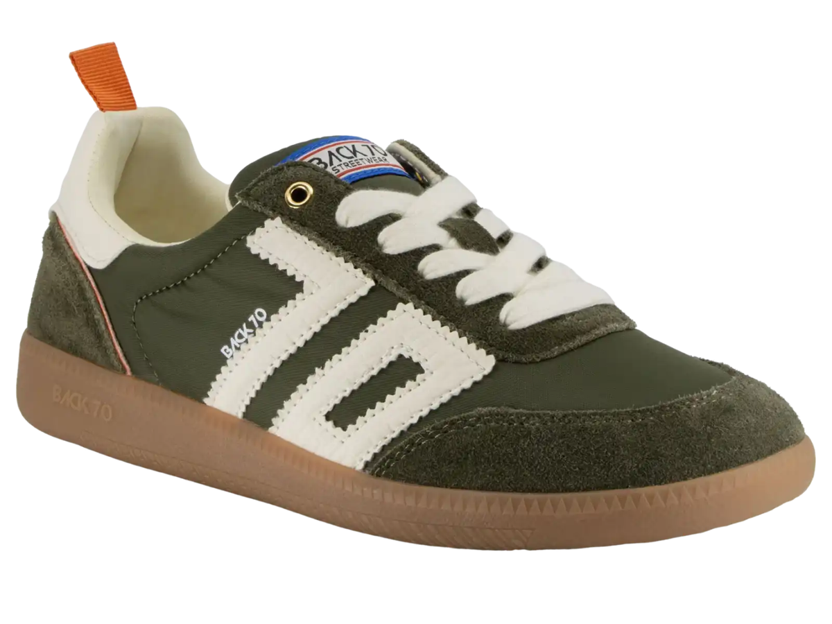 A low-top sneaker by Backyo, featuring an olive green suede and mesh upper with white contrast panels, white laces, a brown gum sole, and an orange pull tab.