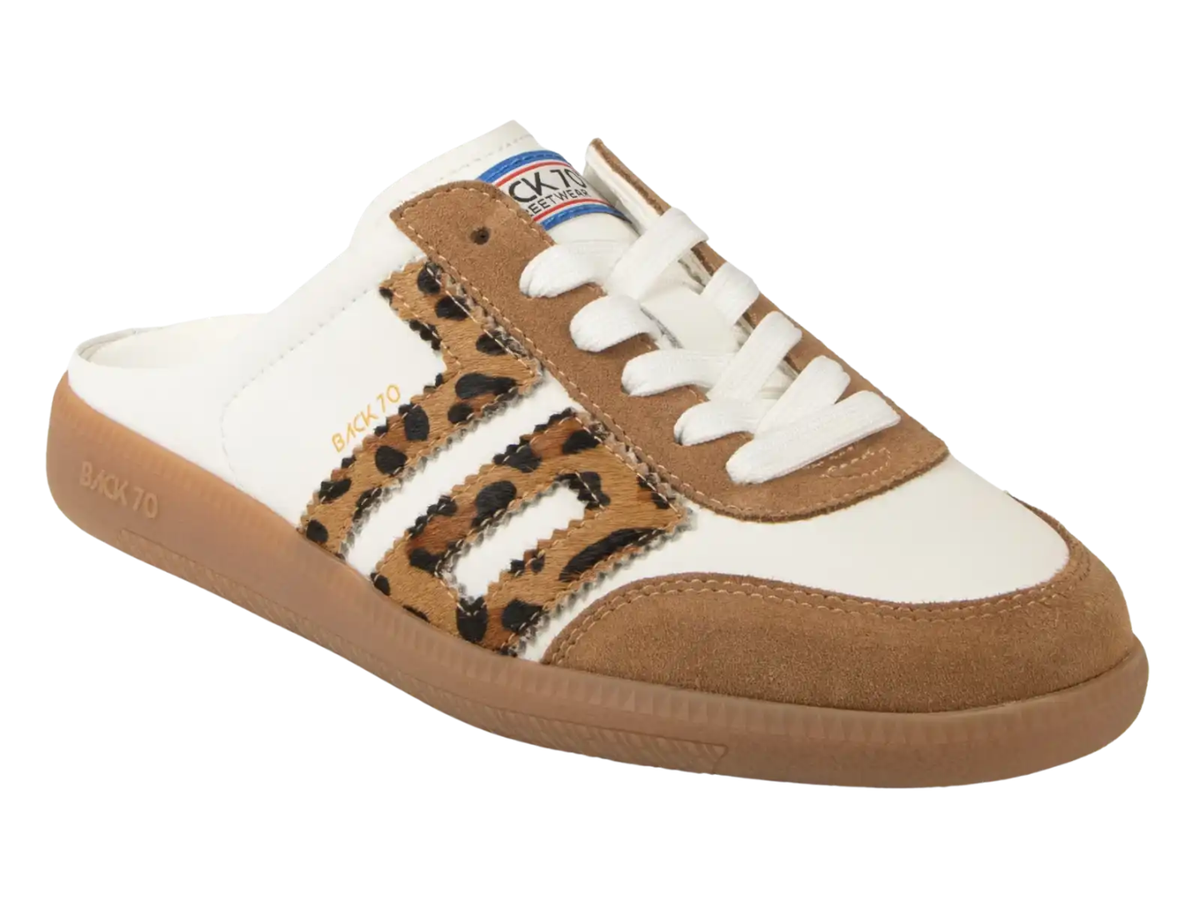A white and brown slip-on sneaker with a leopard print side stripe, white laces, and a gum sole, shown on a plain white background.