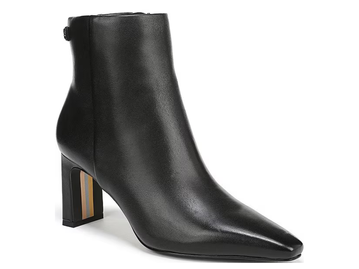 A black leather ankle boot with a pointed toe and a block heel featuring a gold and beige stripe detail, shown against a plain white background.