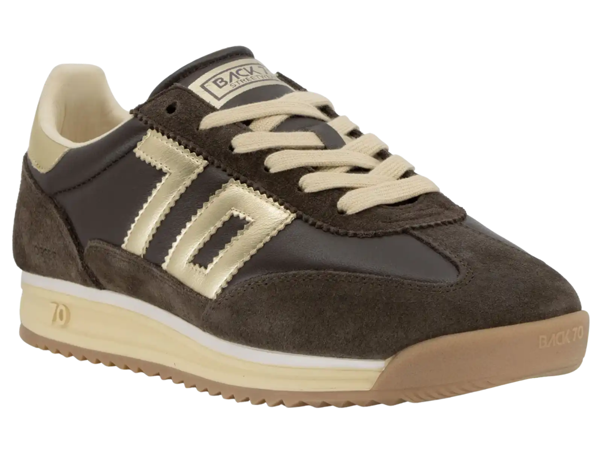 A dark brown suede and leather sneaker with beige laces, a beige side stripe, and a beige midsole, shown on a plain white background.