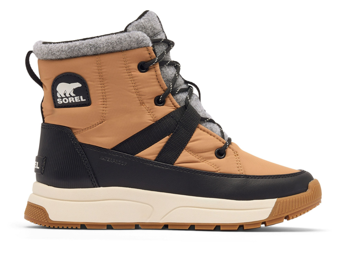 A Sorel mid-height winter boot in tan and black with a gray fleece collar, shown from a side profile on a white background.