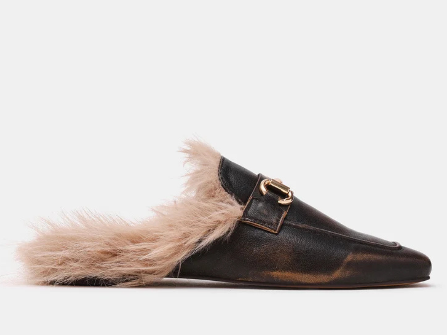 A single dark brown leather slip-on loafer with a fluffy light beige shearling lining and a gold-tone horsebit detail, shown against a plain light gray background.
