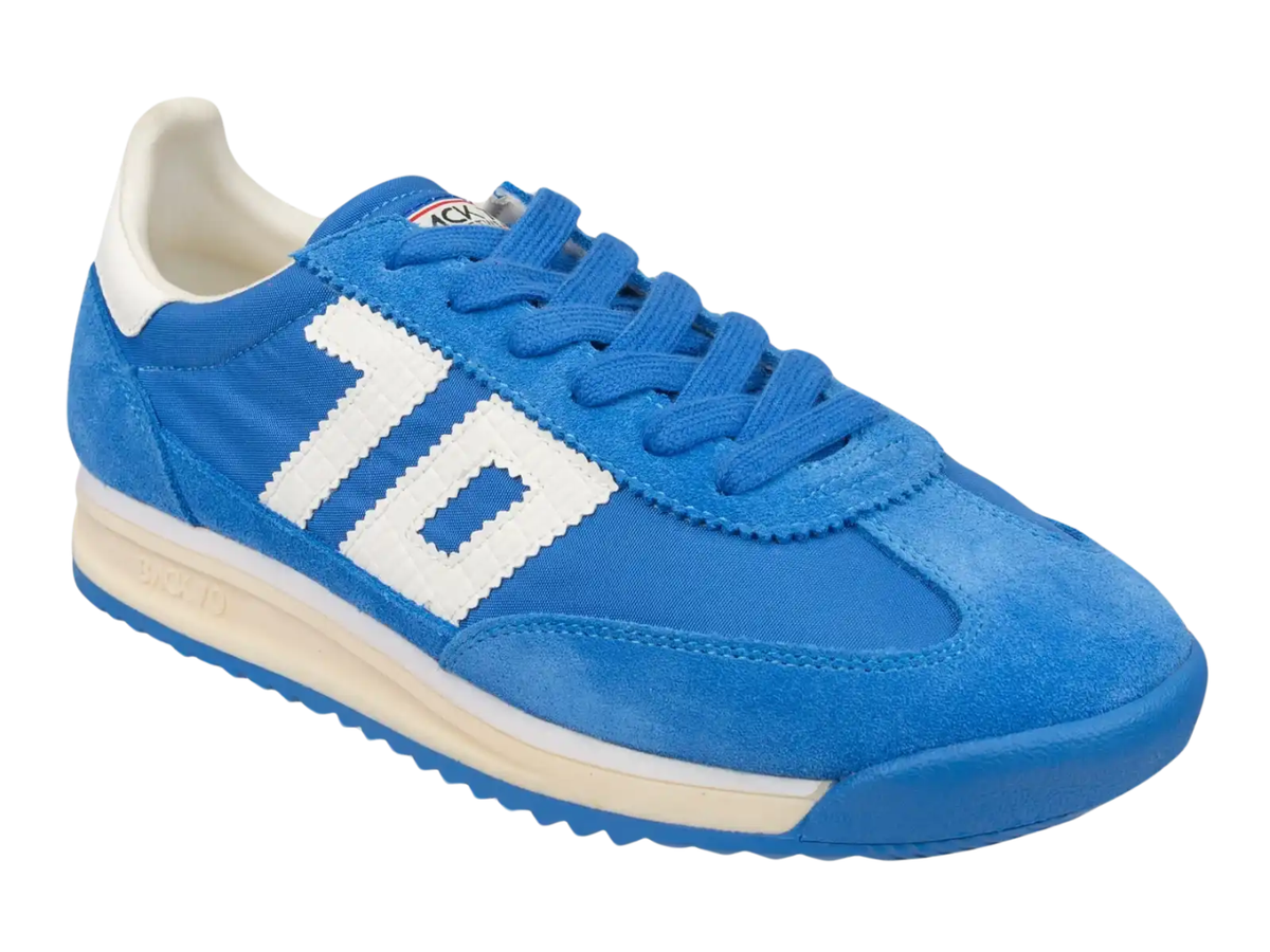 A blue suede and synthetic fabric sneaker with a large white '10' logo on the side, blue laces, and a cream-colored midsole and heel tab, shown on a plain white background.