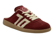 A low-top slip-on sneaker in burgundy suede with cream sherpa fleece side stripes, cream laces, and a tan gum sole, shown on a white background.