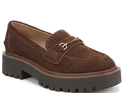 A brown suede loafer with a chunky black lug sole and a silver-tone horsebit detail on the strap, shown against a plain white background.