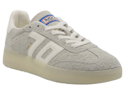 A light gray suede Back Market sneaker with white laces, a white side stripe, and a translucent cream sole, shown on a white background.