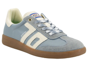 A light blue suede and mesh low-top sneaker with cream-colored side stripes, cream lining, and a brown gum sole. The tongue features a blue and white logo patch.