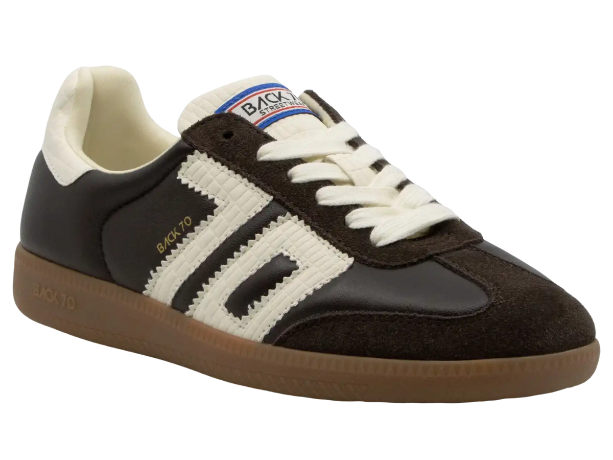 A retro-style low-top sneaker by Back To, featuring a dark brown suede and leather upper with a cream knit three-stripe design, cream laces, a cream collar lining, and a brown gum sole.