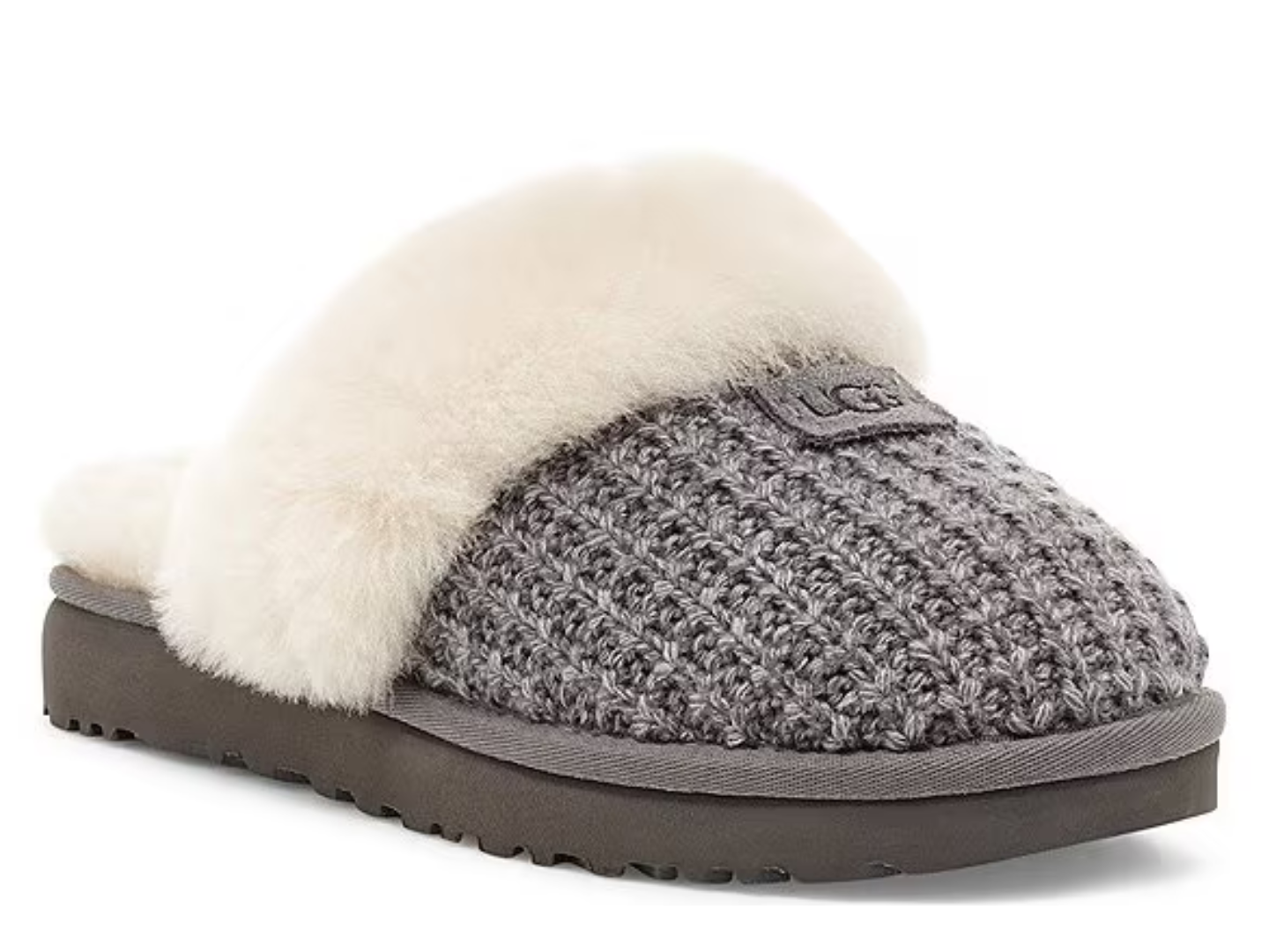 A single UGG slip-on mule slipper with a gray chunky knit upper, cream-colored shearling lining, and a dark brown sole, shown on a plain white background.