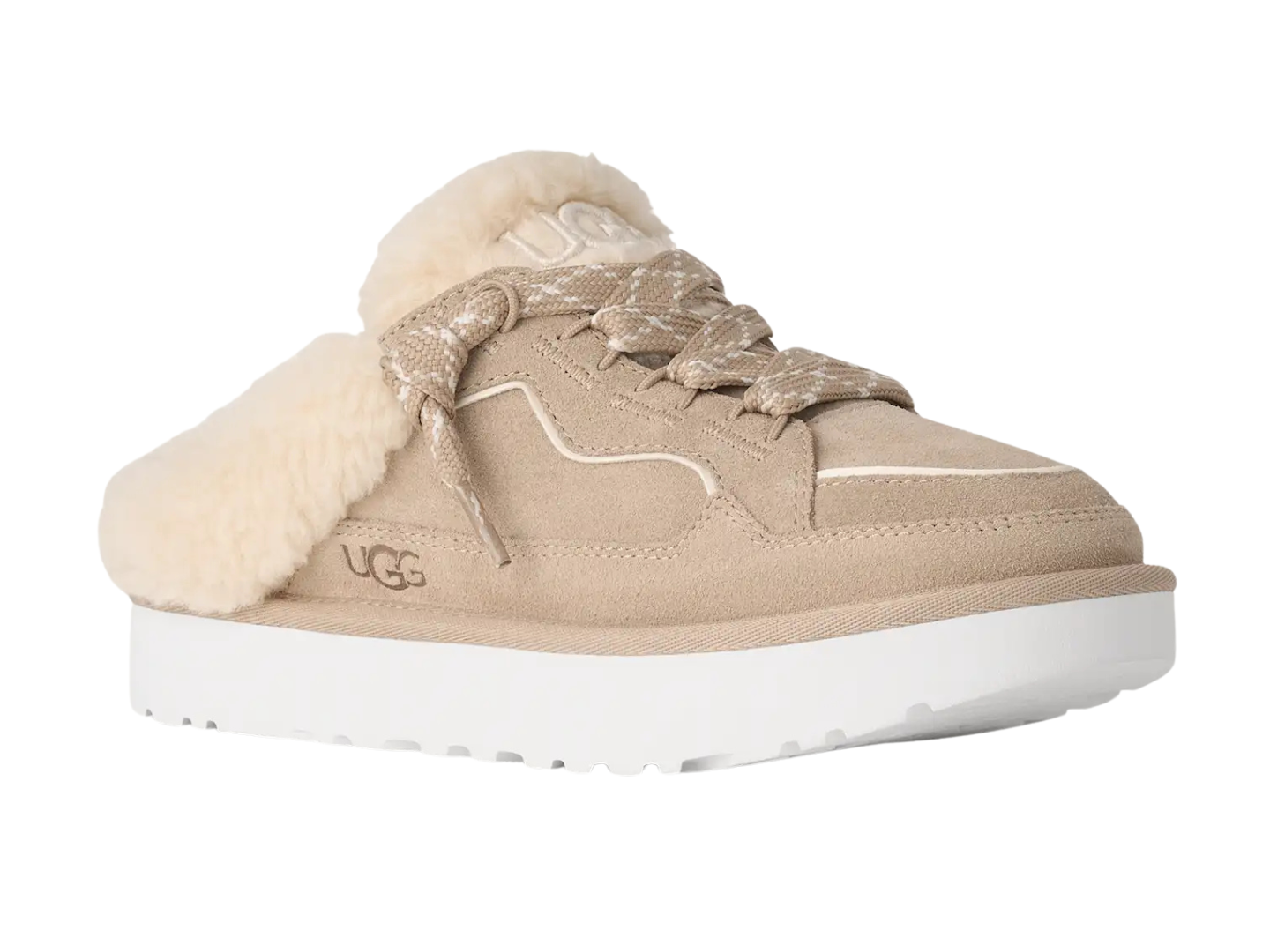A beige UGG slip-on mule sneaker with fluffy cream shearling lining, matching beige laces, and a thick white platform sole.