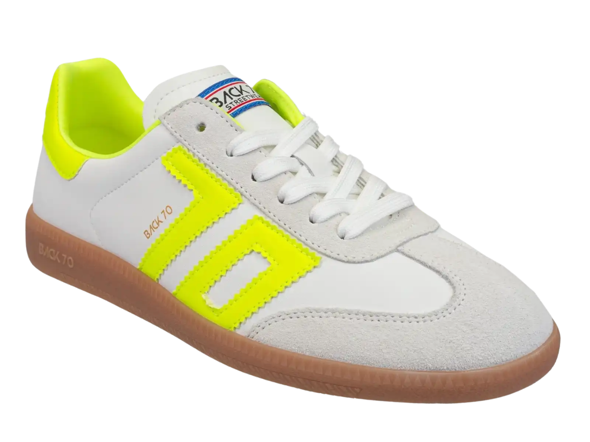 A white Back 70 sneaker with bright neon yellow-green accents on the side stripes, heel tab, and tongue, featuring a white lace-up front and a brown gum sole, shown on a plain white background.
