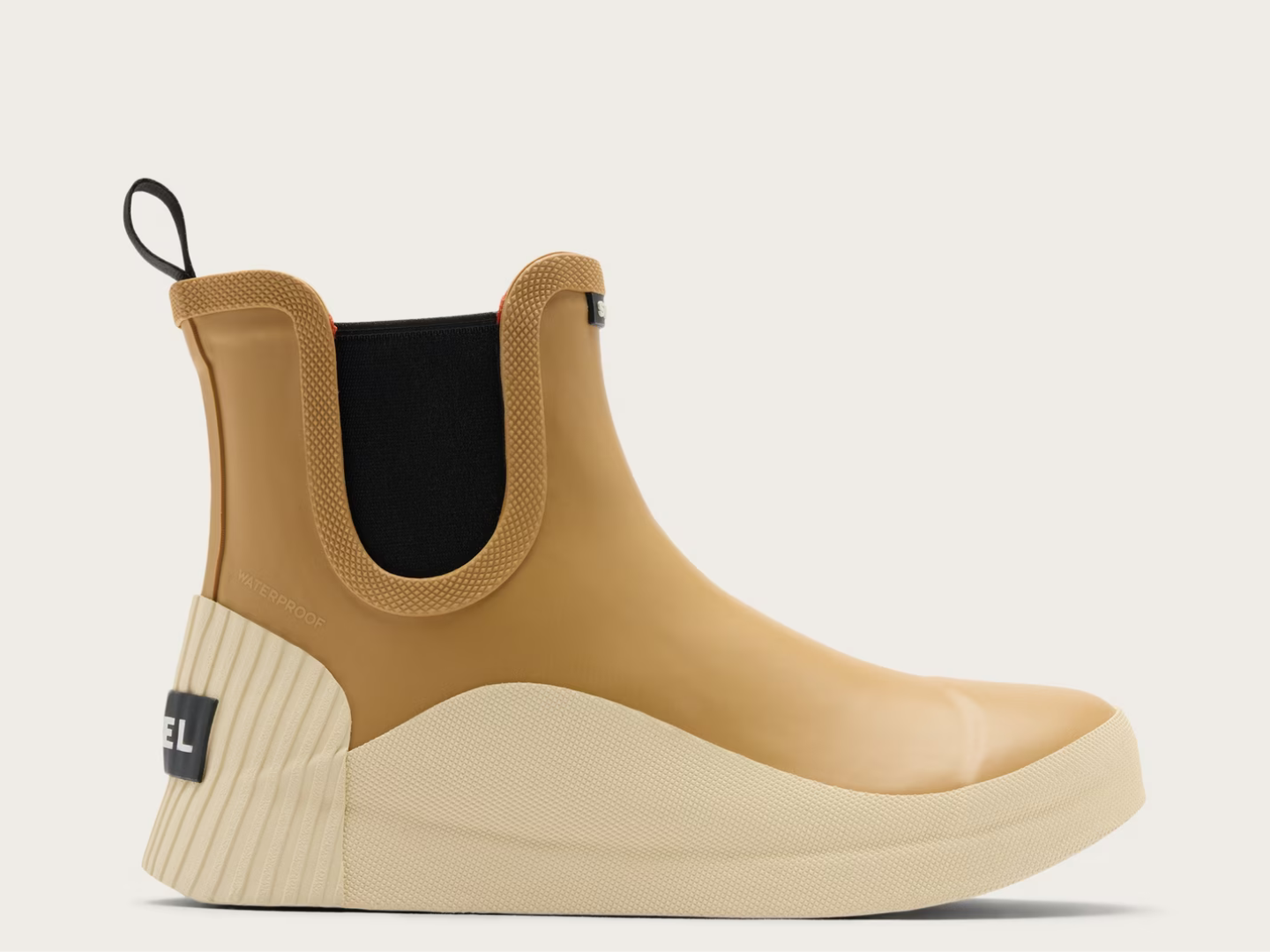 A single Chelsea-style rain boot by Diesel in camel brown and cream, featuring a black elastic side panel and a black heel label, shown against a light off-white background.