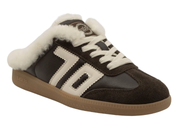 A dark brown suede and leather slip-on sneaker with a thick white faux-fur collar, white laces, and a tan gum sole, shown on a plain white background.