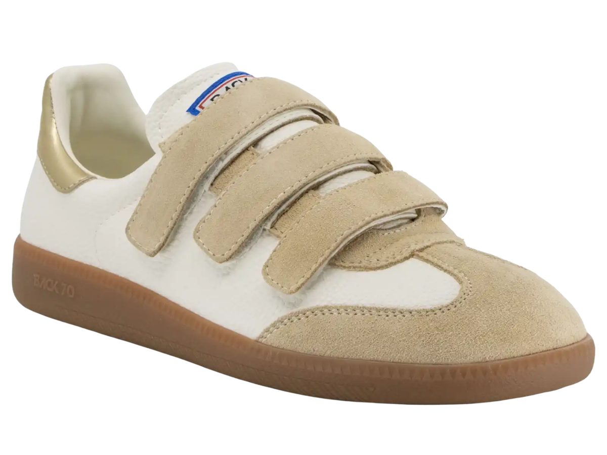 A low-top sneaker with beige suede and white leather panels, featuring three adjustable hook-and-loop straps and a brown gum sole. The brand name 'BLOOM' is visible on the tongue label, and 'BLOOM 70' is embossed on the side of the sole.