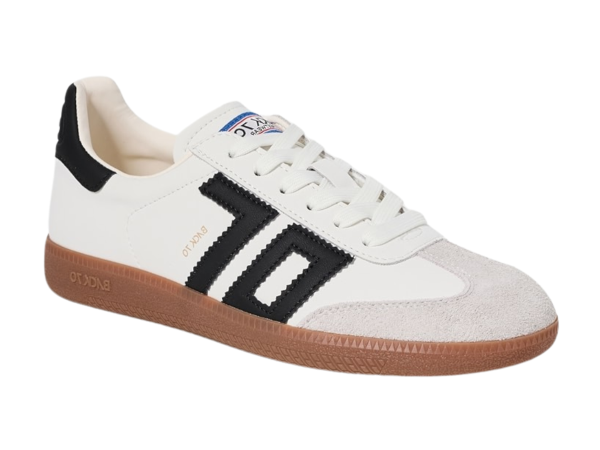 A white suede and leather low-top sneaker with black side stripes, a black heel tab, and a brown gum sole, shown on a plain white background.