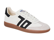 A white suede and leather low-top sneaker with black side stripes, a black heel tab, and a brown gum sole, shown on a plain white background.