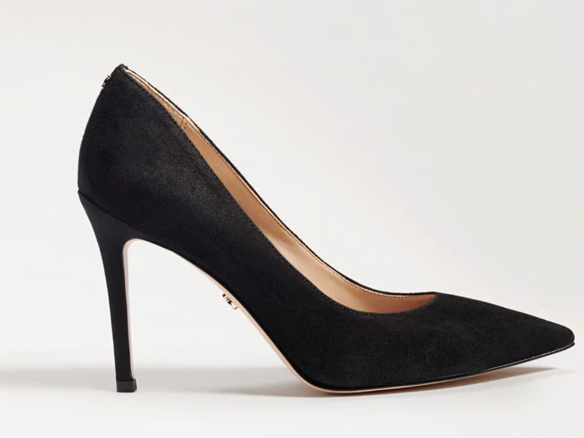 A single black pointed-toe high heel pump in a suede-like finish, shown in a side profile against a clean white background.