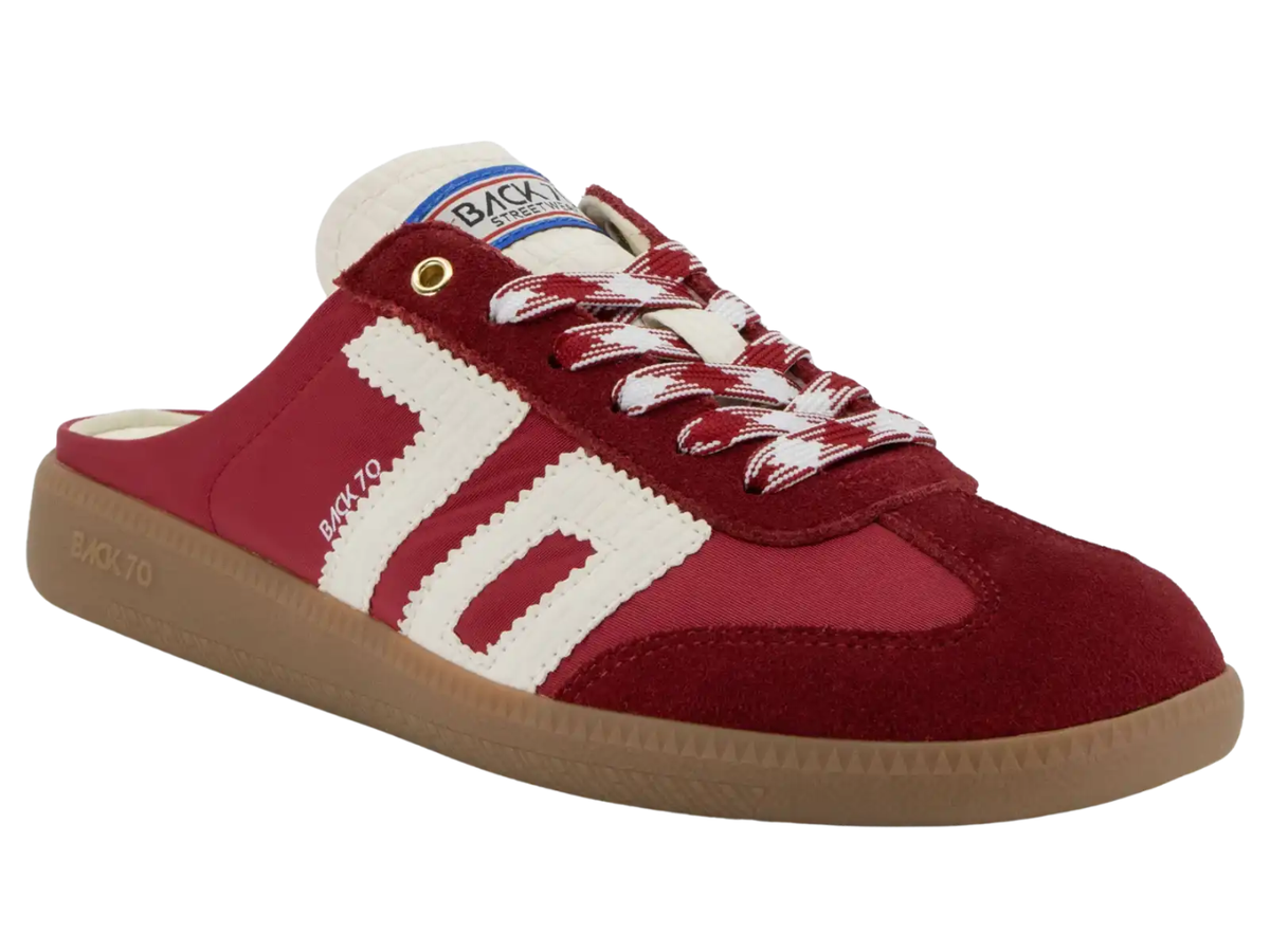 A red and white Bakuco slip-on sneaker with a gum sole, featuring a suede and mesh upper, white laces, and a white side stripe design.