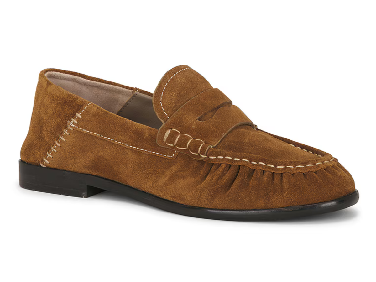 A single brown suede penny loafer shown from a three-quarters angle on a white background.