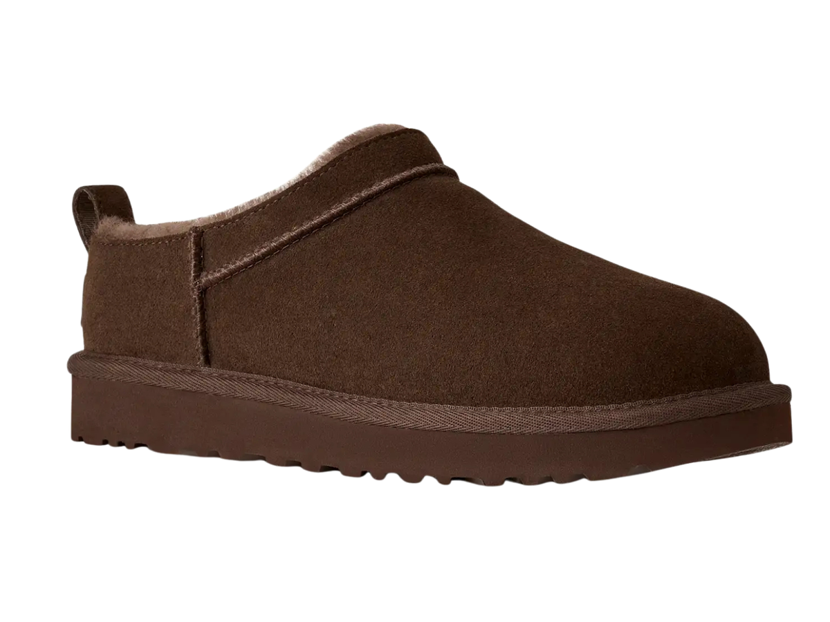 A single dark brown slip-on clog-style shoe with a suede-like finish, pull tab, and thick sole, shown on a plain white background.