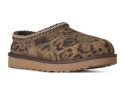 A single slip-on clog shoe with a brown and black leopard print upper, a braided trim around the collar, and a thick tan sole, shown against a plain white background.
