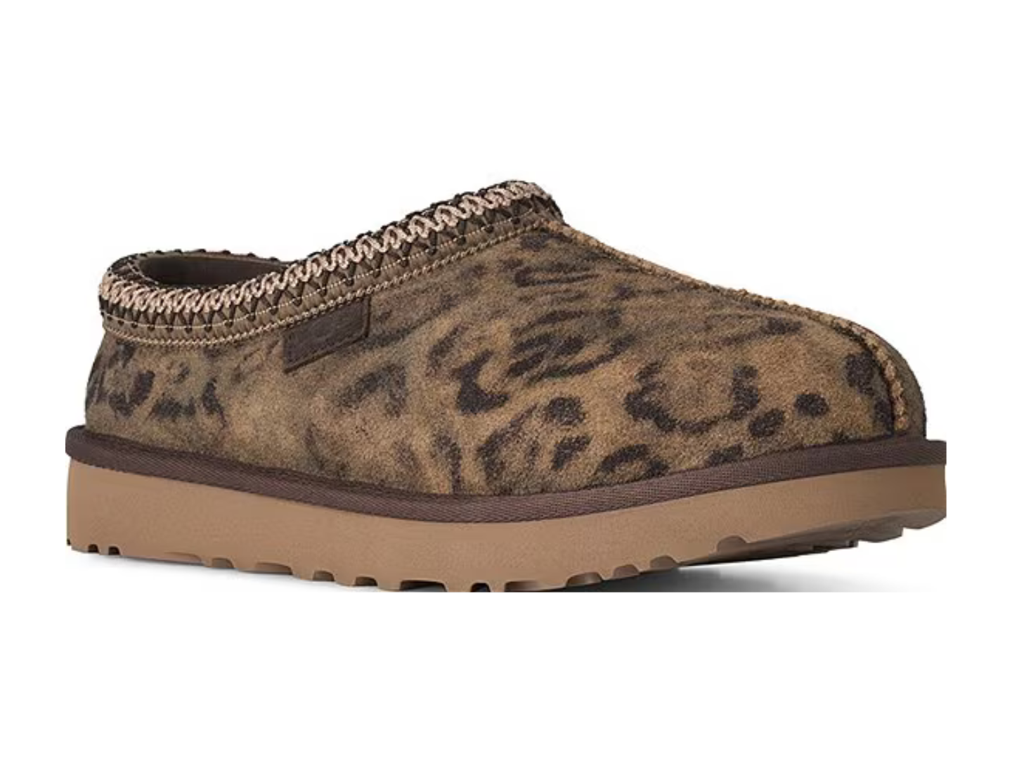A single slip-on clog shoe with a brown and black leopard print upper, a braided trim around the collar, and a thick tan sole, shown against a plain white background.