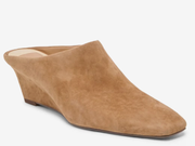 A tan suede mule shoe with a wedge heel and square toe, shown from a three-quarters angle on a light gray background.