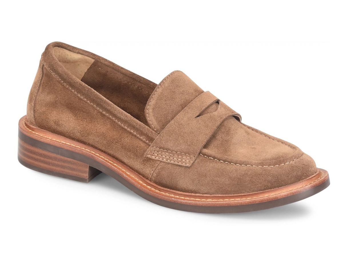A single brown suede penny loafer with a stacked wood-look heel and a light-colored sole, shown from a three-quarters angle on a white background.